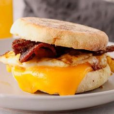 a bacon and egg sandwich on a plate