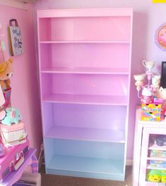 a pink and blue book shelf in a child's room