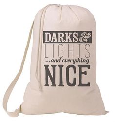 a white bag with the words darks and lights and everything nice on it