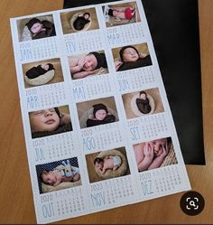 a calendar with pictures of babys on it sitting on top of a wooden table