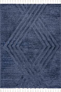 a blue rug with diamond shapes on the side and fringes in the middle,