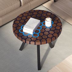 a coffee table with a book and a cup on it