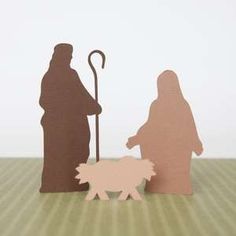 paper cut out of the nativity scene with sheep and shepherd