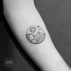 a black and white photo of a person's arm with a clock on it