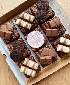 a box filled with lots of different types of cookies