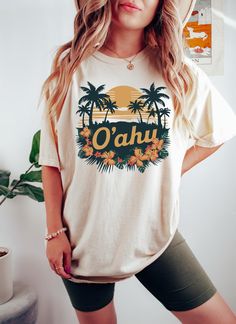 Celebrate the vibrant beauty of Oahu, Hawaii with our exclusive design, available on Comfort Colors T-Shirts, Long Sleeves, Hoodies, Sweatshirts, and Kids Tees. Perfect for island lovers, travelers, and outdoor enthusiasts, this high-quality apparel captures the stunning beaches, lush landscapes, and vibrant culture of one of America's most beloved islands. Whether you're exploring the trails or enjoying a casual day, our Oahu collection offers comfort and style for every adventure. Available in Hawaiian Cotton Tops With Screen Print, Green Hawaiian Cotton T-shirt, Green Cotton Hawaiian T-shirt, Hawaiian Cotton T-shirt, Hawaiian Cotton T-shirt With Sublimation Print, Hawaiian Style Crew Neck Top With Screen Print, Cotton Hawaiian Crew Neck T-shirt, Island Adventure, Kids Tees