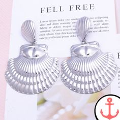 Big Metal Shell Earrings: Perfect for the Passionate Sea Lover Introducing our stunning Big Metal Shell Earrings, the perfect accessory for anyone who has a deep love for the sea and its enchanting symbols. These earrings are part of our popular Shell Earrings collection, where you can find a wide variety of nautical-themed earrings that will make you feel like you're always close to the ocean. Whether you're attending a beachside party or simply want to add a touch of the sea to your everyday s Elegant Beach Jewelry Made Of Alloy, Ocean-inspired Metal Jewelry, Shell-shaped Metal Earrings, Beach Metal Drop Earrings, Metal Drop Earrings For Beach, Metal Shell-shaped Earrings, Beach Drop Earrings In Metal, Elegant Nickel-free Beach Earrings, Elegant Nickel-free Earrings For The Beach