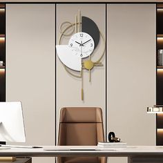 an office with a desk, chair and large clock on the wall above it's head