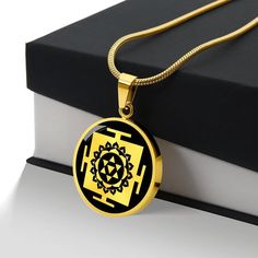 "Unique Personalized Baglamukhi Yantra Necklace!  ➜ Our patent-pending jewelry is made of high quality surgical steel with an 18k gold finish option. ➜ Our jewelry is personalized in the U.S.A by awesome working moms just like yours! We hire and train working mothers and pay a living wage. We are proud to support strong communities and keep jobs in America! This Bagalamukhi Yantra Pendant Is the Perfect Keepsake! Whether for Yourself or a Loved One. ➜ If the custom engraving option is available, engrave onto the back of the pendant your loved one's name, your wedding date, an anniversary, or anything else you want to remember and keep you close to her heart. Each personalized piece offers exceptional craftsmanship that is fit to be an instant classic in your family. We Offer a 100% Happine Symbolic Jewelry For Navratri Rituals, Symbolic Jewelry For Puja And Navratri, Symbolic Jewelry For Navratri Puja, Navratri Gift Temple Necklace, Round Temple Necklace For Navratri Gift, Black Necklaces For Navratri Gift, Black Necklaces For Navratri As A Gift, Black Jewelry Gift For Navratri, Black Jewelry For Navratri Gift