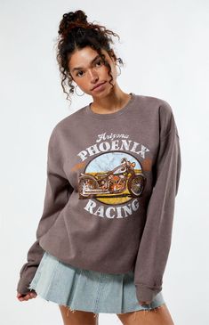 Add a touch of retro charm to your wardrobe with the Phoenix Arizona Racing Sweatshirt from Golden Hour. Featuring a vintage-inspired Phoenix Arizona Motorcycle Racing graphic, classic crew neckline, and long sleeves, this sweatshirt exudes old-school cool. Whether you're hitting the streets or chilling at home, it's the perfect choice for a stylish and comfortable look.Solid color sweatshirtLong sleevesCrew necklineFront graphicRibbed trimming50% cotton, 50% polyesterMachine washableModel is wearing a size M/LModel measurements: 5’7” height, 32” bust, 24” waist, 35” hip Golden Hour Womens Phoenix Arizona Motorcycle Racing Crew Neck Sweatshirt - Brown size XS/S Retro Fall Fan Gear Sweatshirt, Vintage Fan Gear Sweatshirt With Crew Neck, Vintage Crew Neck Fan Gear Sweatshirt, Coffee Color Graphic Print Crew Neck Sweatshirt, Vintage Hard Rock Cafe Sweatshirt, Motorcycle Racing, Women Hoodies Sweatshirts, Phoenix Arizona, Pacsun