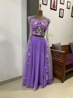 Full Stitched Lavender Floral Embroidered Designer Lehenga - we will make it according to your requirements. It's perfect for your functions. And makes it memorable. Fabric and Work Lehenga Choli: Lehenga and Choli is made of georgete  fabric. The floral design on the choli is made with silk threads, shades of beads and sequins. It lined with crape and inside finished with soft cotton fabric. Overcoat: A beautiful net overlay embellished with floral work enhance the beauty and elegance of the en Purple Floral Embroidered Dress With Traditional Drape, Purple Dress With Floral Embroidery In Traditional Drape, Purple Dress With Floral Embroidery And Traditional Drape, Traditional Lavender Sharara For Reception, Lavender Semi-stitched Sets With Intricate Embroidery, Traditional Lavender Floral Embroidered Dupatta, Traditional Lavender Sets With Intricate Embroidery, Traditional Lavender Set With Intricate Embroidery, Purple Chikankari Traditional Wear For Reception