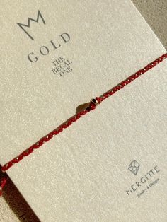 ◖ Details◗ ‣ 14kt Solid Gold Bead  -rondelle 3mm-  ‣ Italian Red String & Gold Metallic String (A quality) ‣ Adjustable double closure  ‣ Hand knotted ‣ This Beaded Bracelet is placed in our elegant black Mergitte Designs Envelope on it's special 'Gold' card, coming with a Thank you card ready for gift giving.  ◖ We Love focusing on Details, using only High Quality Materials, so to make our jewelry so Special and Unique! ◗ ◖ Shipping & Packaging ◗ ‣ All orders will be shipped via tracked shippin Minimalist 14k Gold Red Bracelets, Minimalist Red 14k Gold Bracelets, Gift Red 14k Gold Bracelet, Minimalist Red 14k Gold Bracelet, Red Bracelets With Tiny Beads As Gift, Red 14k Gold Dainty Bracelet, Red Gold Jubilee Bracelet For Gift, Red Jubilee Gold Bracelet Gift, Minimalist Red Beaded Bracelets As Gift