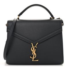 This is an authentic SAINT LAURENT Grain de Poudre Medium Classic Monogram Cassandra Top Handle in Dark Smog. This chic shoulder bag is crafted of pebble grain grey leather. The bag features a rear patch pocket, gusseted side panels, a sturdy leather top handle, and an optional, adjustable shoulder strap with aged gold hardware. The envelope-style crossover flap opens with a matching aged gold YSL monogram press lock to a partitioned burgundy leather interior with a patch pocket. Bag Wishlist, Classic Monogram, Designer Bag, Side Panels, Grey Leather, Leather Interior, Leather Top, Panel Siding, Gold Hardware