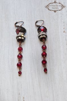 Boho Chic Earrings, Long Dangle Earrings , Red Burgundy Earrings, Gift for Her , Antique Rhinestones Features different shapes of red Burgundy crystal beads with an interesting transparency and antique rhinestones . Measures approx. 3'' - 7,5 cm long With copper lever back ear hooks. Bohemian but also classy and elegant those earrings are for special occasions ... 🌹Select from VintageRoseGallery as many items as you like at the SAME SHIPPING COST Your order will be shipped REGISTERED and with f Red Long Drop Earrings With Ear Wire, Red Dangle Clip-on Earring, Red Dangle Single Clip-on Earring, Red Vintage Dangle Chandelier Earrings, Vintage Red Dangle Chandelier Earrings, Red Dangle Earrings For Pierced Ears, Red Vintage Chandelier Dangle Earrings, Burgundy Drop Earrings For Party, Red Metal Dangle Earrings