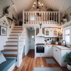 a kitchen and stairs in a small house