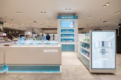 a store display with skin care products on the counter and in front of it is a sign that says skintric