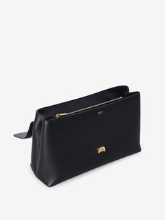 This bag is like that effortlessly chic friend who always knows what to wear—timeless and sophisticated without trying too hard. Made in Italy with care, it's perfect for days when you need a little extra room without compromising on style. The subtle gold-tone accents and smooth calfskin make it a versatile companion for any occasion. Crafted from black grained calfskin Sliding chain shoulder strap for versatile wear Magnetic closure with gold-tone Triomphe detail Two main interior compartments Trying Too Hard, Popular Bags, Metal Detail, Winter Color, Celine Bag, Winter Colors, Large Bag, Color Code, Parisian Style