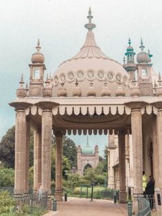 an ornate gazebo in the middle of a park