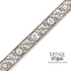 This sparkling vintage, circa 1900's, Edwardian diamond link bracelet is masterfully crafted in platinum. The bracelet contains ten large center diamonds, the center of which is an Old Mine Cut (OMC), flanked by the other nine larger Old European Cut (OEC) diamonds. The center OMC diamond is approx 1.35 carats and is an H color VS1 clarity. The two larger of the flanking diamonds are approximately 3/4 carats each, while the remaining 7 larger diamonds are approximately 1/4 carat each. Finally, e Vintage Platinum Diamond Bracelet With Single Cut Diamonds, Art Deco Diamond Tennis Bracelet With Brilliant Cut, Art Deco Brilliant Cut Diamond Bracelet For Anniversary, Art Deco Round Diamond Bracelet Brilliant Cut, Vintage Diamond Bracelet With Brilliant Cut For Formal Occasions, Art Deco Platinum Tennis Bracelet With Diamond Accents, Art Deco White Gold Diamond Bracelet With Brilliant Cut, Art Deco Platinum Diamond Wedding Bracelet, Art Deco Platinum Diamond Bracelet