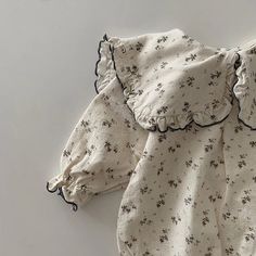 🌸 Elevate your little one's style with our Floral Print Romper with Headband! 🌼 Perfect for 0-24 months, this adorable romper is made from comfy cotton, ideal for spring and autumn adventures. 🍂 Designed for baby girls, it features a charming floral pattern, a turn-down collar, and a covered button closure. With full sleeves and a perfect fit, your baby will bloom in cuteness! 🌟 Don't miss out on this delightful romper—a must-have in every baby's wardrobe. Shop now and dress your baby girl i Spring Long Sleeve Bubble Romper For Playtime, Cute Cotton Onesie For Spring, Cute Spring Cotton Onesie, Spring Playtime Long Sleeve Bubble Romper, Spring Playtime Bubble Romper With Long Sleeves, Cute Jumpsuits And Rompers For Fall Playtime, Cute White Jumpsuits And Rompers For Fall, Cotton Long Sleeve Bubble Romper For Playtime, Cute Long Sleeve Bubble Romper For Spring