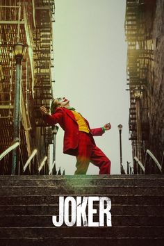 the joker movie poster is displayed in front of an urban scene with stairs and buildings