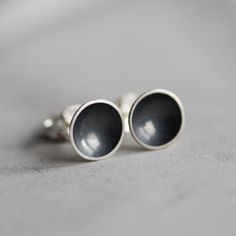 "These stud earrings made in the form of a cup are a perfect piece for a girl with a modern taste. These minimalistic earrings are simple and elegant. Made of silver oxidized to black, these studs have a very refined look. The earrings are made of oxidized sterling silver and are lightweight. The size of the cup is approx. 4mm (3/16\") or 7mm (1/4\"). This item is made to order, the production time is up to 5 days. You will receive them gift wrapped for no additional charge." Minimalist Black Sterling Silver Earrings, Everyday Black Oxidized Earrings, Minimalist Oxidized Round Earrings, Minimalist Round Earrings With Oxidized Finish, Minimalist Hand Forged Earrings, Minimalist Silver Earrings With Oxidized Finish, Minimalist Everyday Jewelry With Oxidized Finish, Everyday Minimalist Jewelry With Oxidized Finish, Simple Black Sterling Silver Jewelry