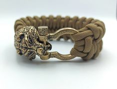 The Bear head custom bracelet is made of 550 paracord and hand crafted shackle and bear clasp of Italian bronze. It`s made to order so you can chose the color and size of the cord bracelet. The Bear bracelet is made with inspiration on Viking and Slavic mythology and jewelry. It`s can be a perfect men's gift for who likes paracord bracelets, EDC and survival. The rope bracelet transports in a wooden gift box. Other paracord bracelets by the link: https://www.etsy.com/shop/WikkedKnot?ref=seller-p Durable Paracord Braided Bracelet For Outdoor, Durable Paracord Bracelets For Outdoor, Bear Bracelet, Bear Jewelry, Slavic Mythology, Custom Bracelet, Bear Head, Wooden Gift Boxes, Paracord Bracelet