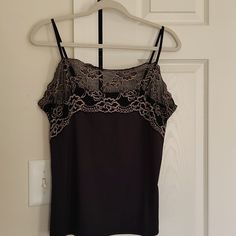 Black Camisole With Beautiful Lace Pinkish Brownish Color Trim. Beautiful Style For Added Elegance To Any Outfit. Nylon And Spandex. Nwot. Mint Condition. Adjustable Straps. Soft Stretchy Microfiber Body. Machine Washable. Great With Suits Wearing Alone. Sleeveless Brown Tops For Night Out, Brown Sleeveless Top For Night Out, Chic Brown Camisole Tank Top, Chic Brown Tank Camisole, Chic Brown Cami Top, Brown Stretch Tank Top For Night Out, Brown Camisole Tops For Night Out, Stretch Brown Tank Top For Night Out, Stretch Lace Top Camisole For Night Out