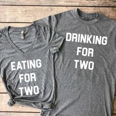 two t - shirts that say drinking for two and eating for two on the front