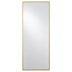 a large gold framed mirror on a white wall