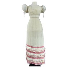 Circa 1815-1820 France or Provence Rare summer cotton Embroidered Cotton voile dress with cotton thread vermilion dating from the French Première Restauration. Wide balloon sleeves tightened by original Cotton link , like the neckline that attaches in the back. very tall and conical skirt whose entire volume are at the back. Three rows of ruffles cotton scalloped matched. Rather loose embroidered vermilion flower garlands adorn the bottom of the skirt . Closing with original hooks in the back. T Regency Style Cotton Summer Dress, Summer Regency Style Cotton Dress, Summer Cotton Regency Dress, Cotton Prairie Dress With Empire Waist In Regency Style, Spring Regency Style Cotton Prairie Dress, Victorian Cotton Dress With Broderie Anglaise, Cotton Regency Prairie Dress With Empire Waist, White Broderie Anglaise Regency Dress, White Cotton Regency Style Prairie Dress