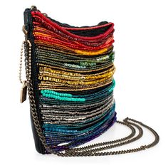 A stunning array of rainbow bead strands adorn the front of this crossbody handbag for a colorful and vibrant look that not only adds a playful movement to your style, but also exudes a passionate and energetic vibe. 10 x 1 x 7" Strap Length End to End: 49" Strap Drop: 23" Removable crossbody chain strap Zipper closure Inside pocket Back pocket Contains leather Fits a phone Includes: metal logo fob, protective storage bag, certificate of authenticity This is a handmade item, each one an individu Multicolor Crossbody Shoulder Bag For Party, Trendy Multicolor Crossbody Clutch, Trendy Multicolor Shoulder Bag For Evening, Multicolor Beaded Shoulder Bag, Rainbow Rectangular Bag For Parties, Multicolor Beaded Crossbody Shoulder Bag, Multicolor Rectangular Shoulder Bag With Colorful Beads, Multicolor Crossbody Shoulder Bag For Evening, Multicolor Crossbody Clutch For Evening