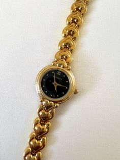 Super cute dainty heart band, black bezel watch. Gold watch stainless steel water resistant. Working with Battery.  Brand: Regency  Condition: Pre-owned, Great Condition  Measurements: Length: 7 inches Face: 0.6 inches x 0.6 inches Gold Watches For Valentine's Day, Elegant Heart-shaped Watch As Gift, Elegant Heart-shaped Watch For Gift, Gold Watches Women Jewellery, Jewelry Moodboard, Dope Jewelry Accessories, Bezel Watch, Accessory Inspo, Heart Band