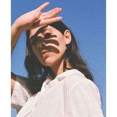 a woman is holding her hands up to the sky with words on it that say, nourishing traholiquan