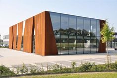 an orange building with many windows on the outside