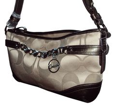 Coach East/West Chain Duffle Handbag Signature Khaki/Bronze  Style: F19724 Inside zip, cell phone and multifunction pockets Zip-top closure, fabric lining Double strap converts to single long strap for shoulder or crossbody wear 12 1/2" (L) x 7 1/4" (H) NEW WITH TAGS Coach Bags With Double Handle And Gunmetal Hardware, Brown Coach Bag With Double Handle, Coach Satchel With Silver-tone Hardware And Double Handle, Coach Black Bags With Silver-tone Hardware, Brown Coach Bags With Silver-tone Hardware, East West, Girls Bags, Bags Handbags, Bag Lady