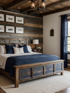 a bedroom with wood paneled walls and blue bedding