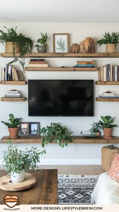 a flat screen tv mounted to a wall above a wooden shelf filled with potted plants