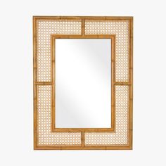 a mirror that is on top of a wooden frame with lattice pattern around the edges