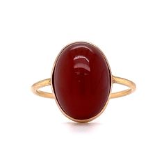 Victorian Bezel Set Carnelian Cocktail Ring in 14k Yellow Gold This stylish Victorian Bezel Set Carnelian Cocktail Ring features a cabochon cut red carnelian in polished 14 karat yellow gold. The center gemstone showcases a warm, crimson red hue. Set in a bezel on a dainty band. Perfect for signet ring & statement ring lovers. Timeless and chic. This antique cocktail ring would make a great gift for any loved one! PRIMARY STONE Stone: Natural Red Carnelian Measurements: 13.90 mm x 10.30 mm  Weig 14k Gold Red Cabochon Ruby Ring, Red Cabochon Ruby Ring In 14k Gold, Red Ruby Oval Cabochon Ring In 14k Gold, Oval Cabochon Red Ruby Ring In 14k Gold, Classic Oval Carnelian Jewelry, 14k Gold Ruby Ring With Oval Cabochon, 14k Gold Polished Oval Cabochon Ruby Ring, Yellow Gold Carnelian Jewelry With Polished Finish, Classic Carnelian Rings With Polished Finish