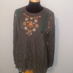 This Cute Top Has Front Embroidery And Lace. It Has Long Sleeves With Elastic Around The Bottom. The Back Is An Open Back With A Top Button Closure. Cam Be Dressed Up Or Down! Armpit To Armpit Is 22 Inches And Length Is 27 Inches. It Is An Oversized Fit So A Size Large Could Wear, Too Casual Multicolor Embroidered Top With Embroidered Hem, Long Sleeve Top With Multicolor Embroidery And Embroidered Hem, Spring Long Sleeve Blouse With Embroidery, Multicolor Embroidered Long Sleeve Top For Fall, Fall Cotton Top With Intricate Embroidery, Fall Embroidered Cotton Top, Embroidered Green Blouse For Fall, Casual Long Sleeve Top With Tonal Embroidery, Fall Cotton Blouse With Floral Embroidery