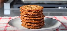 a stack of cookies sitting on top of a white plate