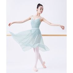 a ballerina in a blue dress is posing for the camera