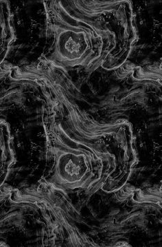 an abstract black and white photo with swirls in the middle, on a dark background