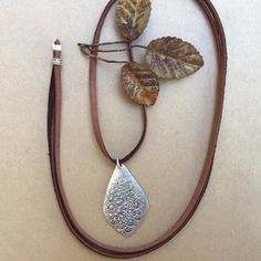 New Necklace. Simply Gorgeous Natural Genuine Brown Tone Deerskin Leather Suede Cord Lace Necklace Is Adjustable To Your Desired Length Between 17” And 30" And Can Be Worn Both Short Or Long. Oxidized Silver Floral Stamp Charm Pendant 1.5”L/ 1”W Great Gift Idea Handcrafted / Handmade In Us Item Please Review My Other Handcrafted Unique Exclusive Artisan Jewelry On Sale 10% Discount And Free Shipping For Additional Jewelry Items With Bundle 2+ Fast Shipping Festival Silver Teardrop Necklaces, Silver Teardrop Necklace For Festivals, Silver Teardrop Necklace For Festival, Necklace Leather Cord, Brown Leather Necklace, Cord Lace, Brown Tone, Lace Necklace, Leather Corded Necklace