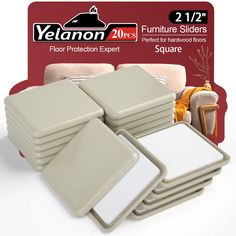 a set of four square table mats with white backings on each side and one for the floor