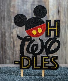 a mickey mouse cake topper with the words h too dies