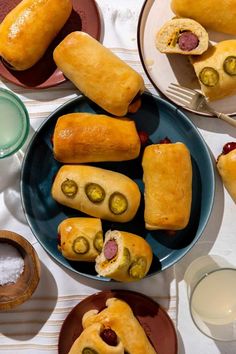 there are many different types of food on the plate and one is wrapped in bread