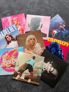 various album covers laid out on the floor