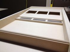 the bottom part of a bed frame is made out of plywood and foamboard